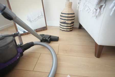 cleaning floor dust with vacuum cleaner.の写真素材
