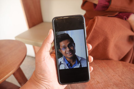 women taking online consultation with doctor on smart phone