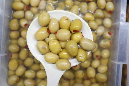 A Bowl Filled with Freshly Pickled Olives Ready to Enjoy as a Snackの写真素材