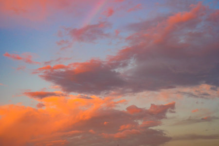 A Stunning and Colorful Sunset Sky Filled with Vibrant and Beautiful Cloudsの写真素材