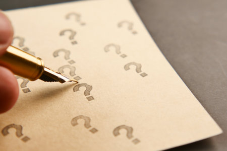question mark on paper on office deskの写真素材
