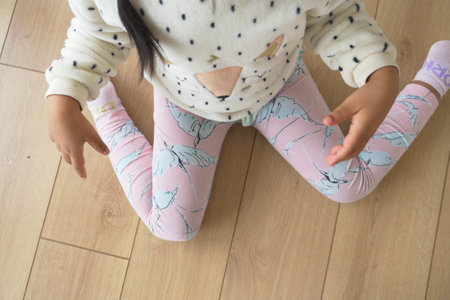 child sitting on the floor .の写真素材