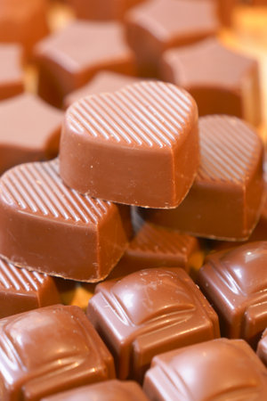 Enjoy a variety of milk chocolate pieces up close, ideal for satisfying sweet cravingsの写真素材
