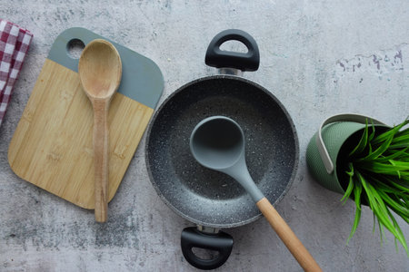 Stylish Kitchen Setup with Trendy Cookware and Essential Utensilsの写真素材