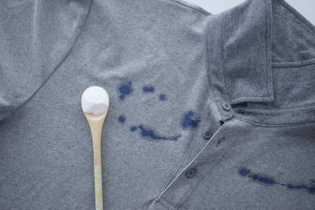 Baking soda on a shirt stain by inkの写真素材