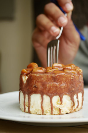 Delicious dessert cake with caramel topping, easy to enjoy with a fork