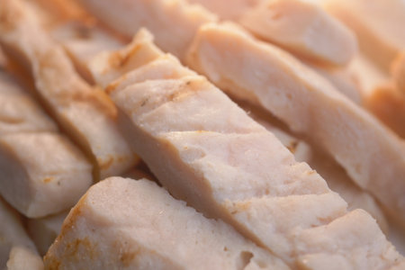 CloseUp View of Sliced Cooked Chicken Breast Ready for Servingの写真素材