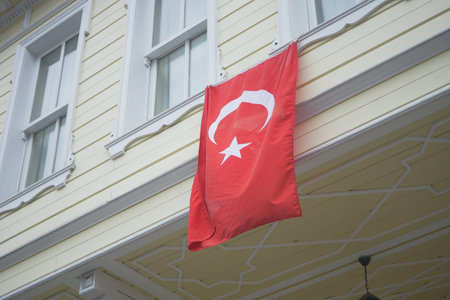 Turkish flag hanging on the windowの写真素材