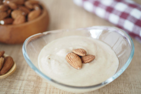 Enjoy a Delicious Almond Cream beautifully served in a Glass Bowl for dessertの写真素材