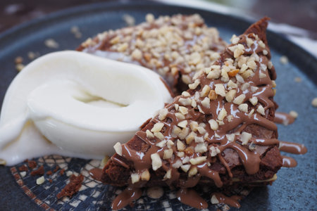 A Deliciously Decadent Chocolate Dessert Featuring Cream and Nuts