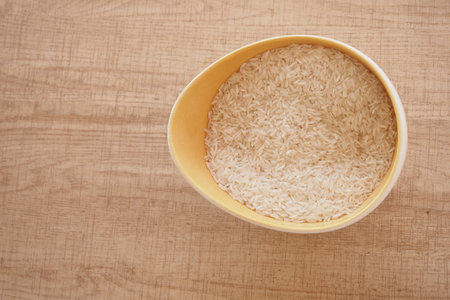 A CloseUp Image Showing White Rice Grains Neatly Arranged in a Pileの写真素材