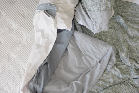 messy bed in early morning , messy bed after waking upの写真素材