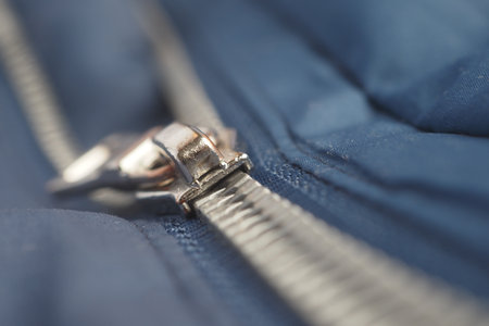 Close-up of a zipper with a sliderの写真素材