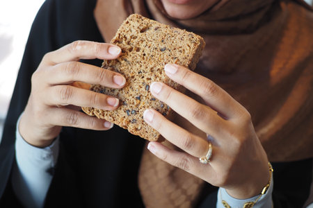 Delicious Snack Time Enjoy Breaking Bread Together in a Cozy Settingの写真素材
