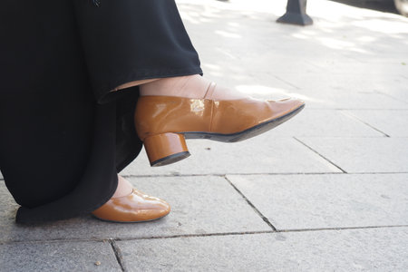 Chic and Elegant Brown Patent Shoes Featuring an Adorable Bow Detail for Styleの写真素材