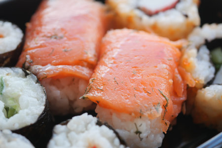 A Delightfully Delicious Assorted Sushi Platter Featuring Fresh Salmon and Various Rollsの写真素材