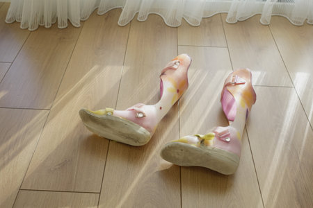 Colorful Child Orthopedic Braces on a wooden floorの写真素材