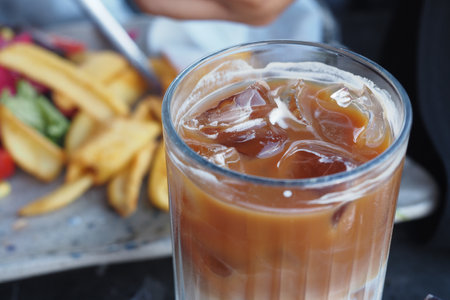 Close up of ice cubes in a glass of coffee,の写真素材