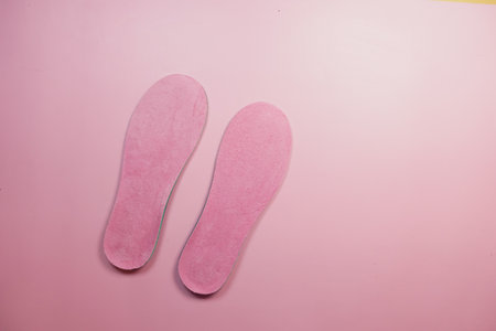 Soft Pink Insoles Set Against a Beautiful Pastel Background Aestheticの写真素材