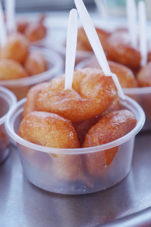 Traditional fried sweets lokma in sugar syrupの写真素材
