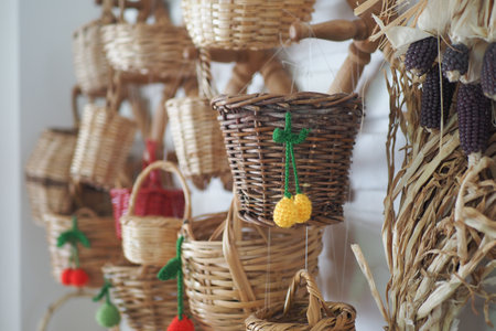 Beautifully Colorful Miniature Woven Baskets Gracefully Displayed on a Wallの写真素材