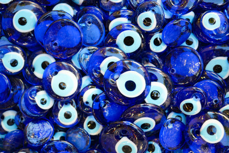 a bunch of blue eye keychains hanging on a shelfの写真素材