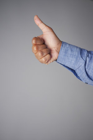 man hand showing a thumb-upの写真素材