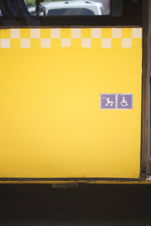 Enhancing accessibility with yellow checkerboard symbols for public transportation icon displayの写真素材