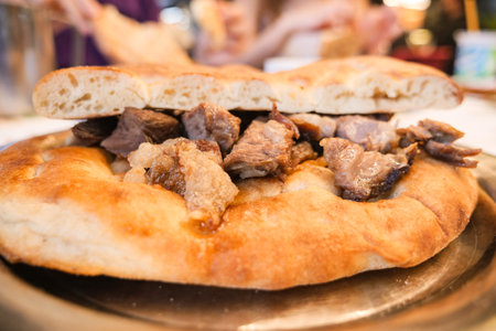 A Scrumptious Plate of MeatStuffed Flatbread Ready to Be Enjoyedの写真素材