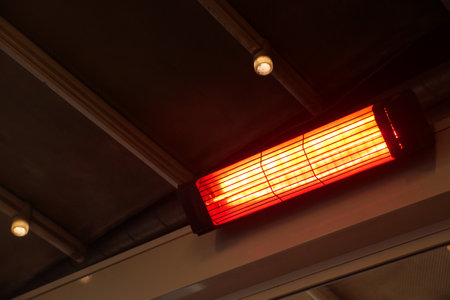 Modern electric infrared heater on ceilingの写真素材