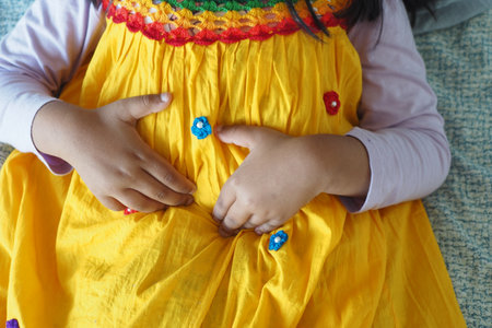 child suffering stomach pain close up.の写真素材