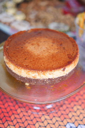 Caramel custard pudding on a plate on tableの写真素材