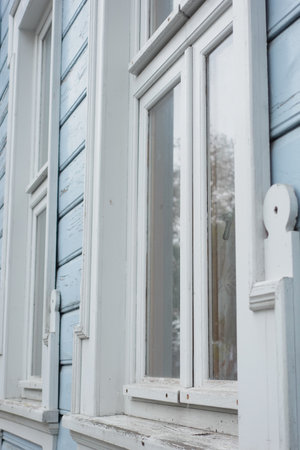 A detailed look at the Vintage Blue Wooden House Windows showcases beautyの写真素材
