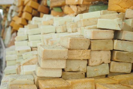 An Array of Colorful Soap Bars Beautifully Stacked at a Market Stallの写真素材
