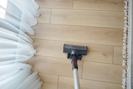 cleaning floor dust with vacuum cleaner.の写真素材