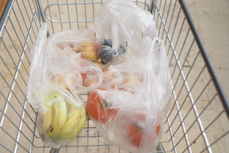 An Abundant Selection of Fresh Produce in Your Grocery Cart Diverse Fruits and Healthy Vegetablesの写真素材