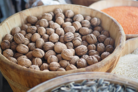 Natural Walnuts Beautifully Arranged in a Wooden Bowl for Display