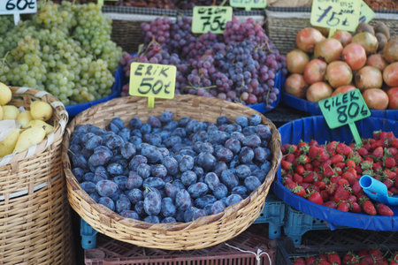 A Colorful Variety of Fresh Fruits Delightfully Displayed at Market Stallの写真素材