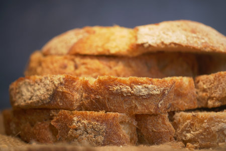 Freshly Sliced Whole Grain Bread Arranged Neatly on Wooden Surface