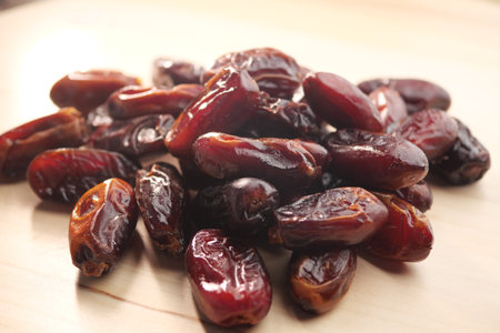 close up of fresh date fruits on a tableの写真素材