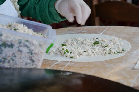 Creating Traditional Dough by Hand with Fresh, Flavorful Fillings Insideの写真素材