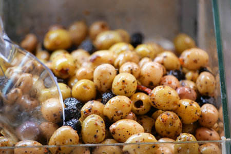 Delicious Marinated Olives Preserved in a Charming Glass Containerの写真素材