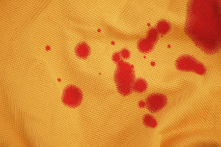 blood stains on a yellow shirt.の写真素材