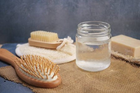 Natural Hair Care Essentials Include Brush, Soap, and Water for Healthy Hairの写真素材