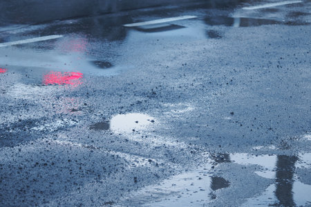 Reflections observed on the wet pavement after a rain shower has endedの写真素材