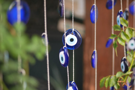 a bunch of blue keychains hanging on a shelfの写真素材