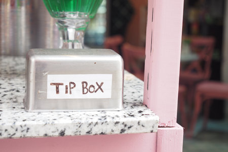 close up of a tips box in a cafeの写真素材