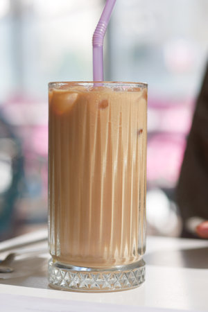 iced late in a transparent glass on cafe tableの写真素材