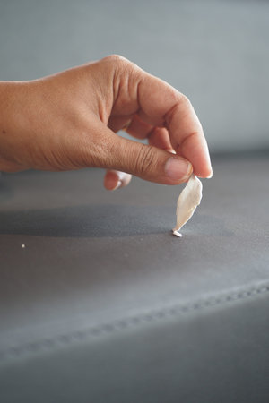 Detailed instructions for effectively removing chewing gum from fabric, with closeup view focus