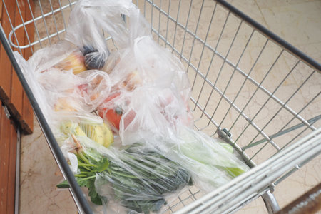 An Abundant Selection of Fresh Produce in Your Grocery Cart Diverse Fruits and Healthy Vegetablesの写真素材
